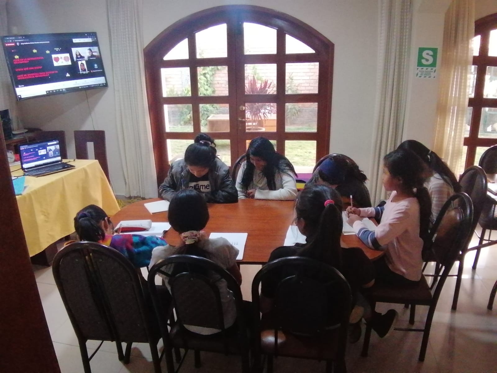 Girls studying in class at the home