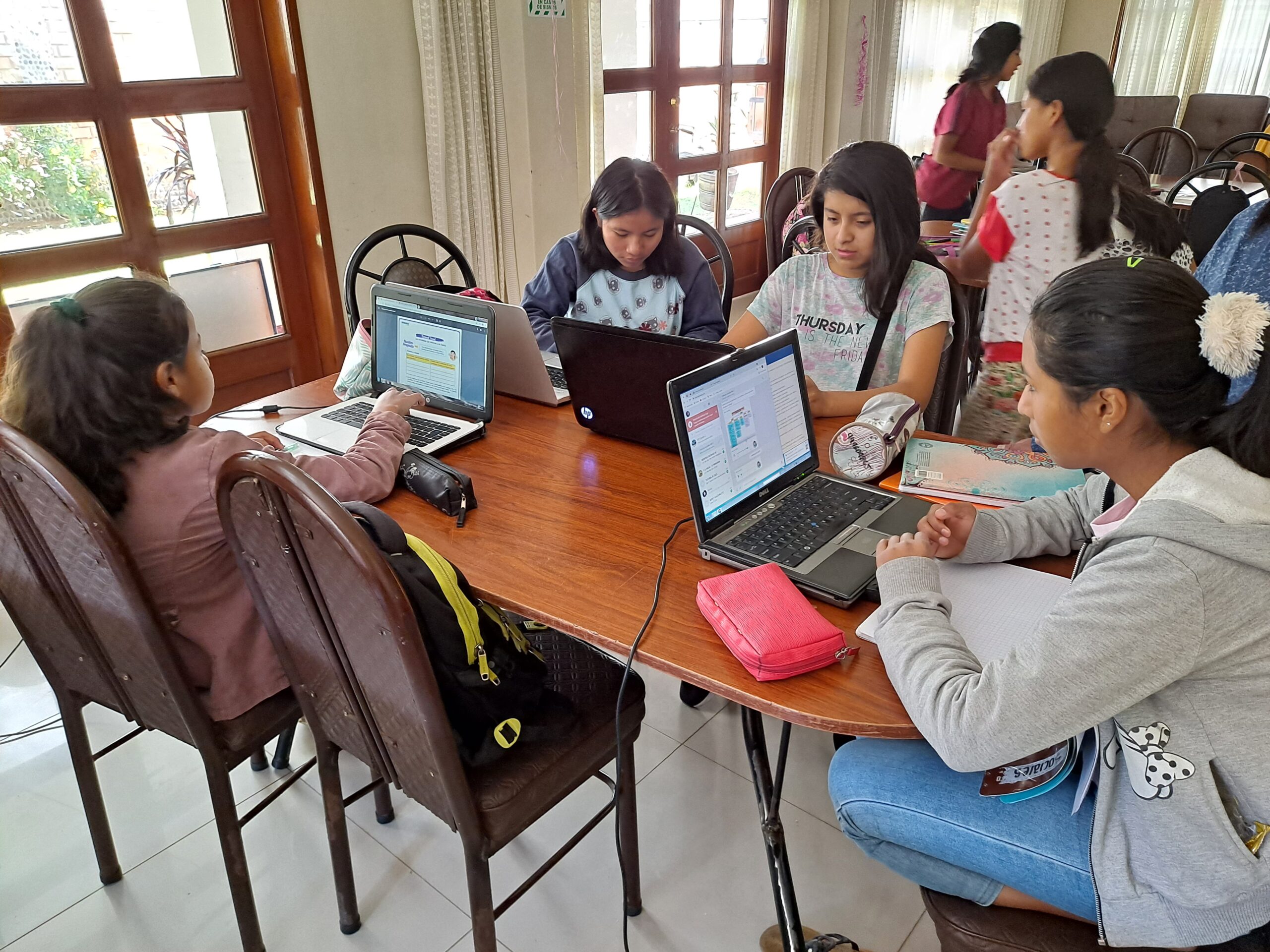Girls learning on laptops