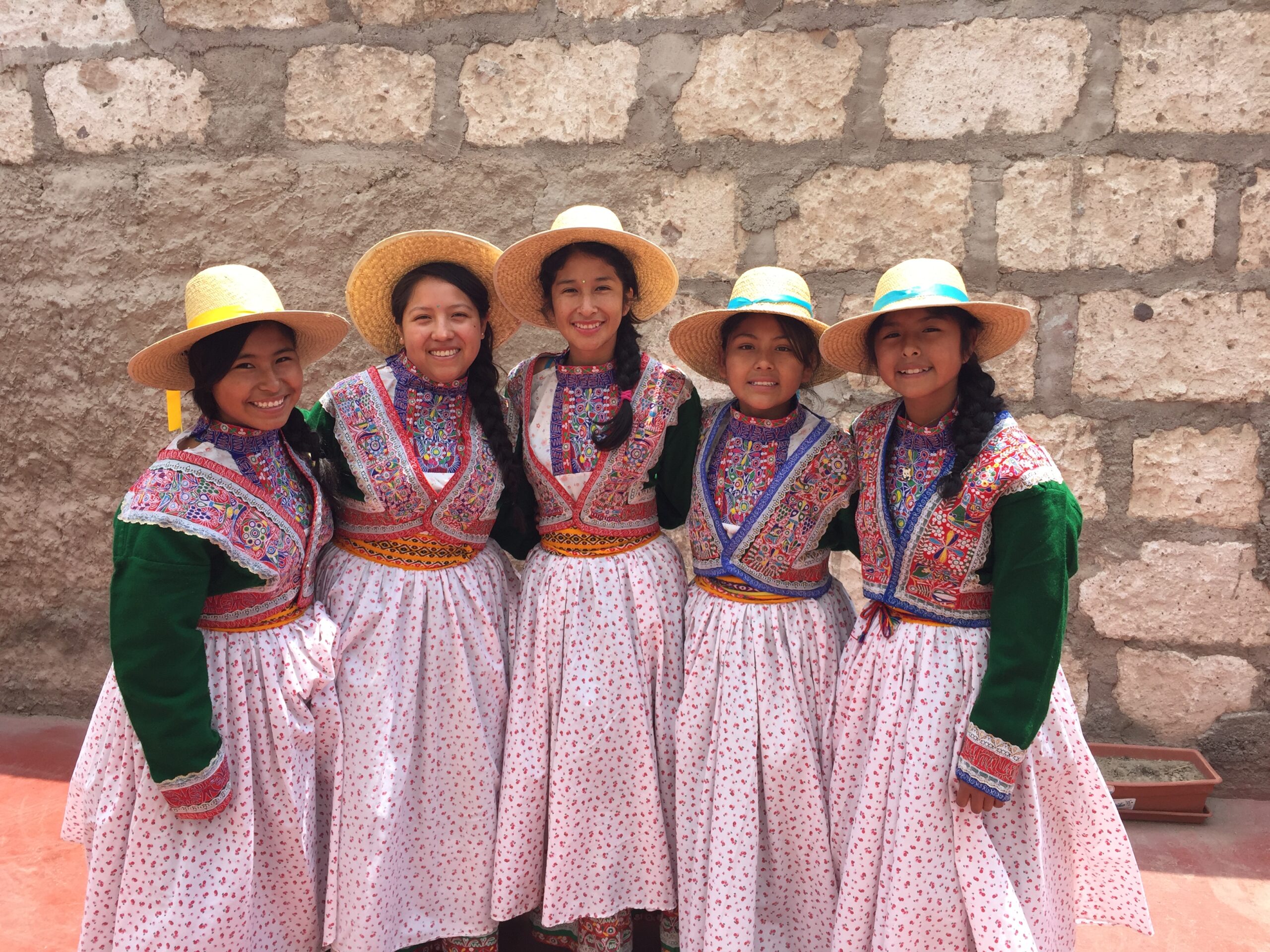 Girls in traditional dresses at the home