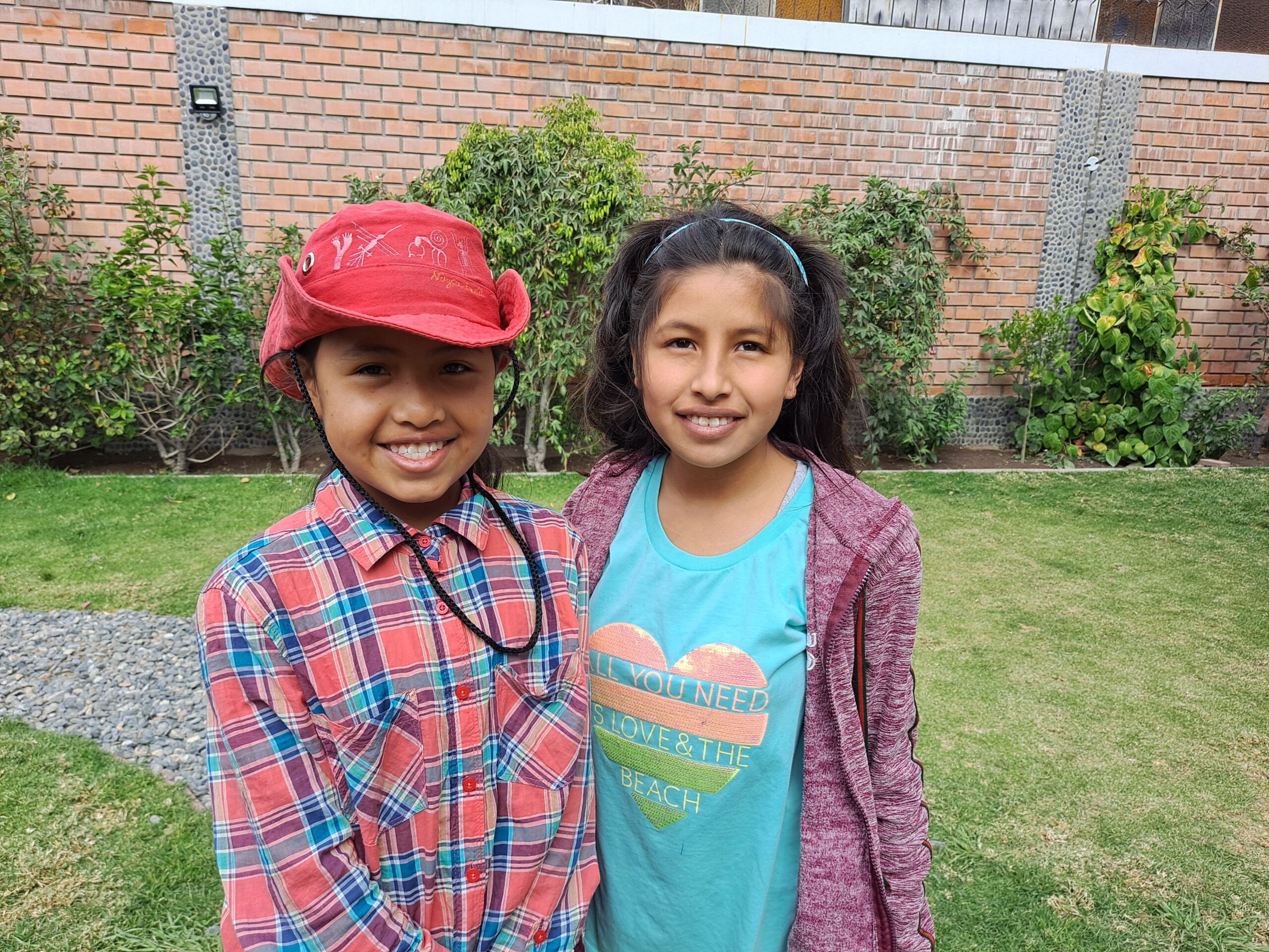 Two friends smiling in the garden at the home